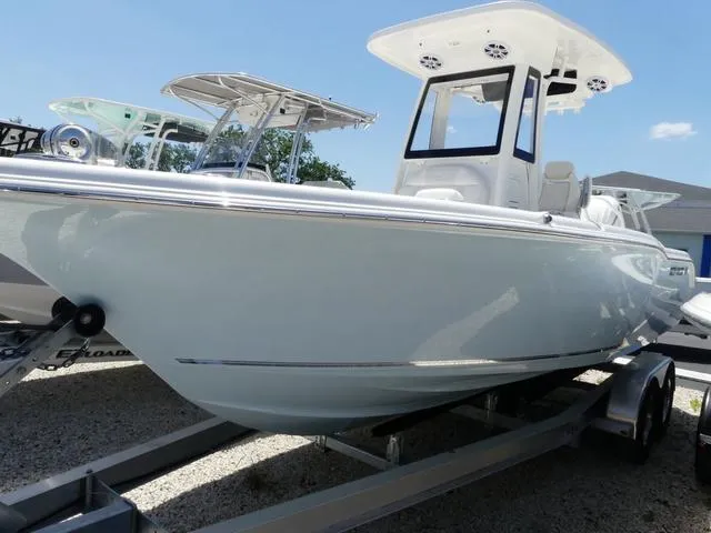 Slide: The Image of 2025 Key West 239 FSR boat on trailer under clear blue sky. - 3