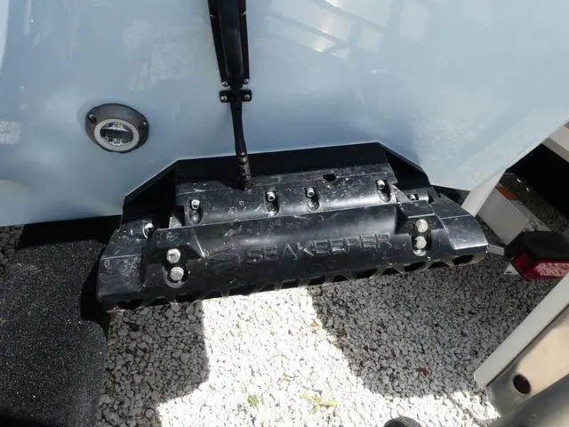 Slide: The Image of 2025 Key West 239 FSR boat with Seakeeper stabilizer on gravel surface. - 6