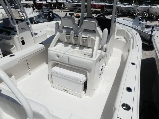 Slide: The Image of 2025 Key West 239 FSR boat interior with seating and storage compartments. - 7