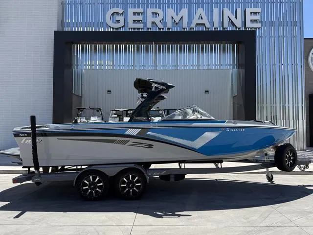 Slide: The Image of 2015 Tigé Z3 boat on trailer, displayed at Germaine dealership. - 1