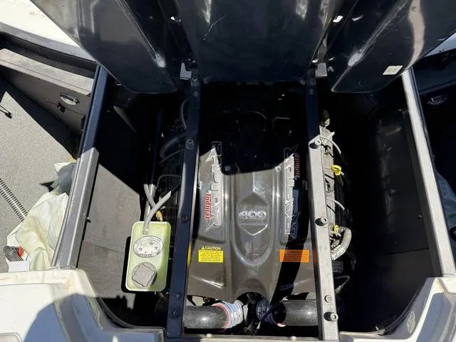 Slide: The Image of Engine compartment of a 2015 Tigé Z3 boat, featuring a powerful Indmar 400 engine. - 12