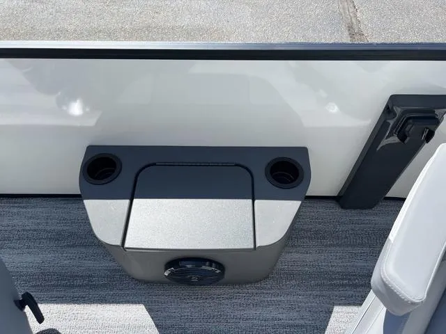 Slide: The Image of 2025 Bennington 22 SSR PTG boat interior with cup holders and speaker. - 11