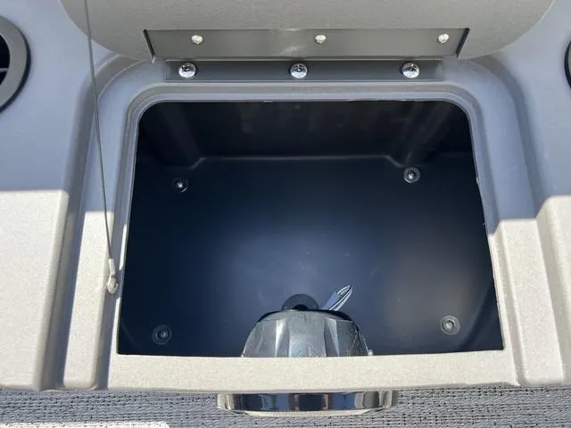 Slide: The Image of Open storage compartment in 2025 Bennington 22 SSR PTG boat console. - 13