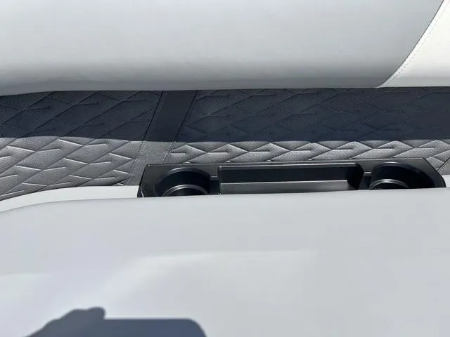 Slide: The Image of 2025 Bennington 22 SSR PTG boat interior with textured upholstery and cup holders. - 15