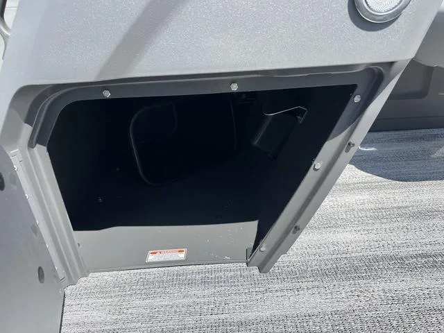 Slide: The Image of Open storage compartment on a 2025 Bennington 22 SSR PTG boat. - 17