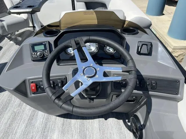 Slide: The Image of Steering console of 2025 Bennington 22 SSR PTG pontoon boat with modern controls. - 20