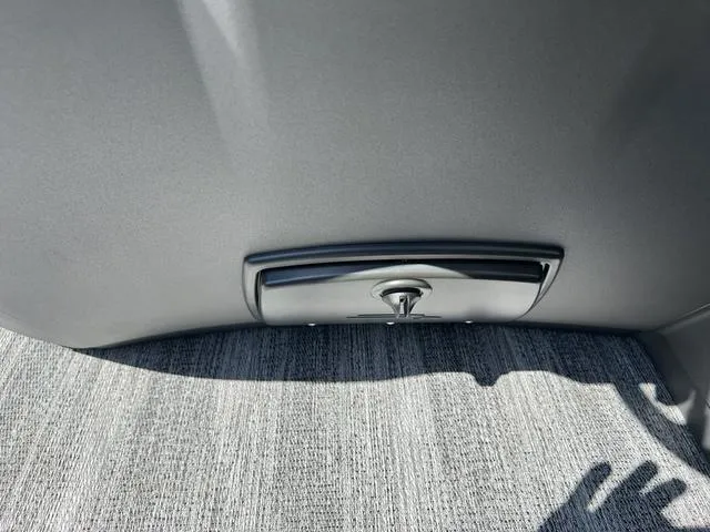 Slide: The Image of Interior detail of 2025 Bennington 22 SSR PTG, featuring a sleek compartment handle. - 22