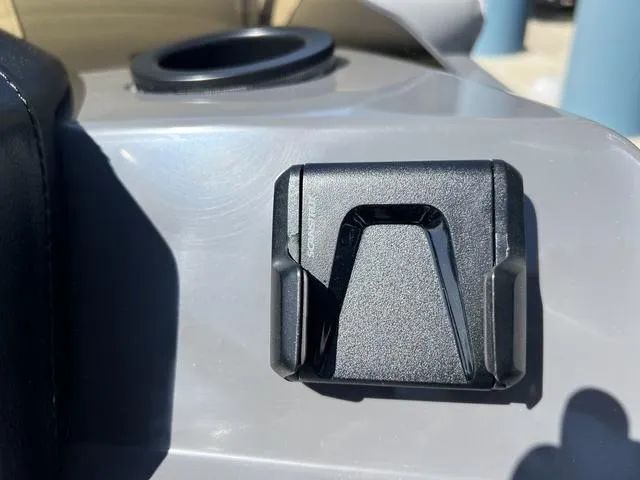 Slide: The Image of 2025 Bennington 22 SSR PTG boat detail, featuring a black accessory mount on a gray surface. - 26