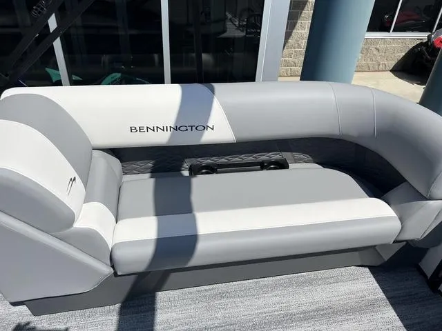 Slide: The Image of 2025 Bennington 22 SSR PTG boat seating in gray and white, outdoor setting. - 29