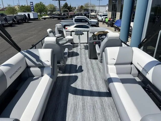 Slide: The Image of 2025 Bennington 22 SSR PTG pontoon boat interior with plush seating and modern design. - 33