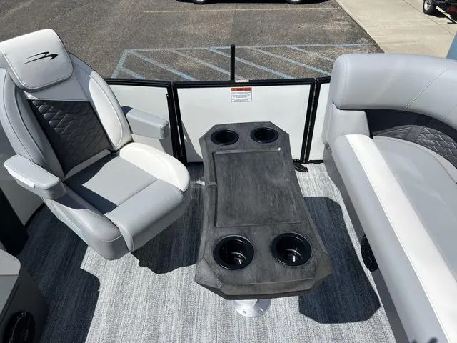 Slide: The Image of 2025 Bennington 22 SSR PTG boat interior with seating and cup holders. - 36