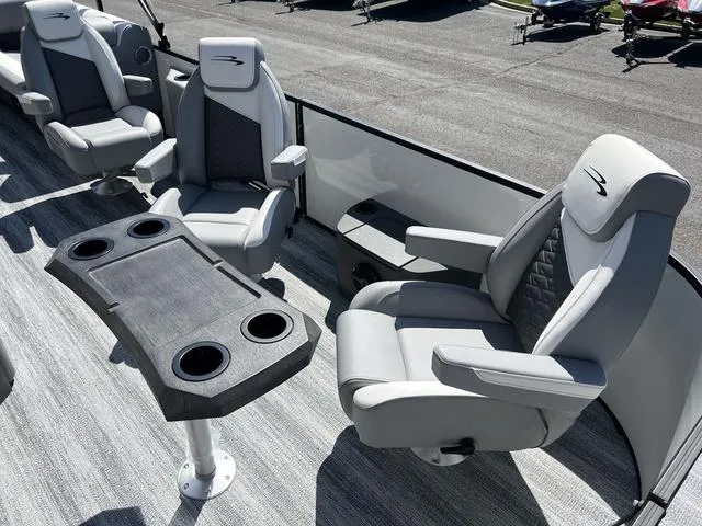 Slide: The Image of 2025 Bennington 22 SSR PTG boat interior with plush seating and cupholders. - 9