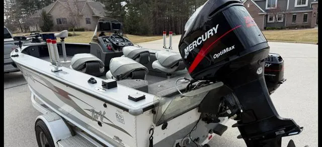 Slide: The Image of 2003 Lund 2025 Pro-V Magnum SE boat with Mercury OptiMax engine on trailer. - 15