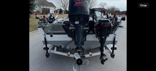 Slide: The Image of 2003 Lund 2025 Pro-V Magnum SE boat on trailer, rear view with outboard motors. - 4
