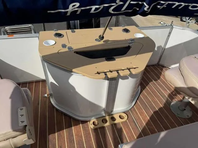 Slide: The Image of 2016 South Bay 523FCR 2.75 boat interior with wood flooring and seating area. - 13