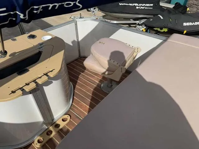 Slide: The Image of 2016 South Bay 523FCR 2.75 pontoon boat interior with seating and wood flooring. - 14