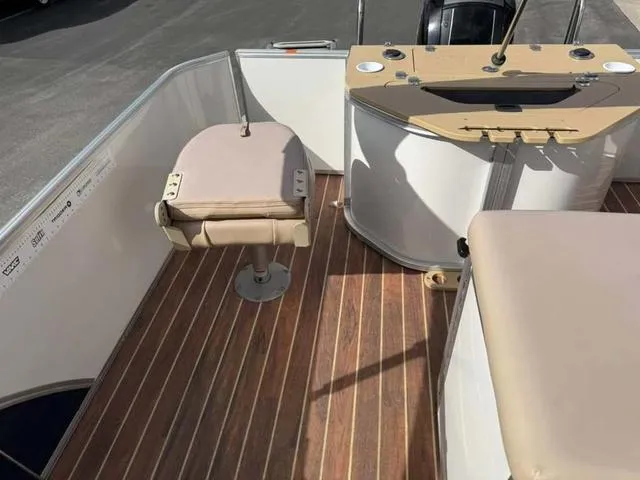 Slide: The Image of 2016 South Bay 523FCR 2.75 boat interior with seating and control panel. - 15