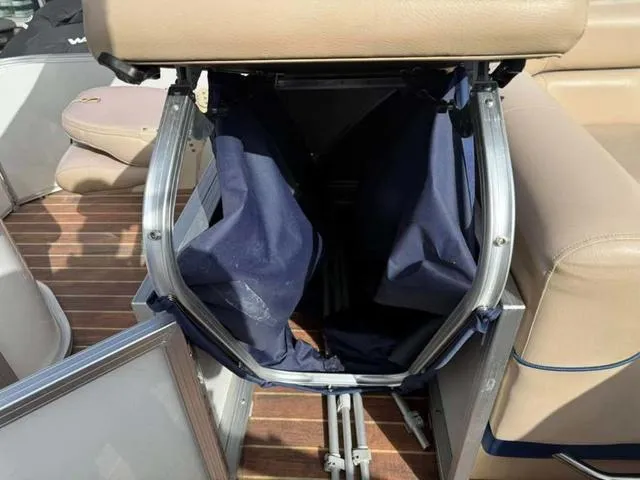 Slide: The Image of 2016 South Bay 523FCR 2.75 boat interior with storage compartment and seating. - 16
