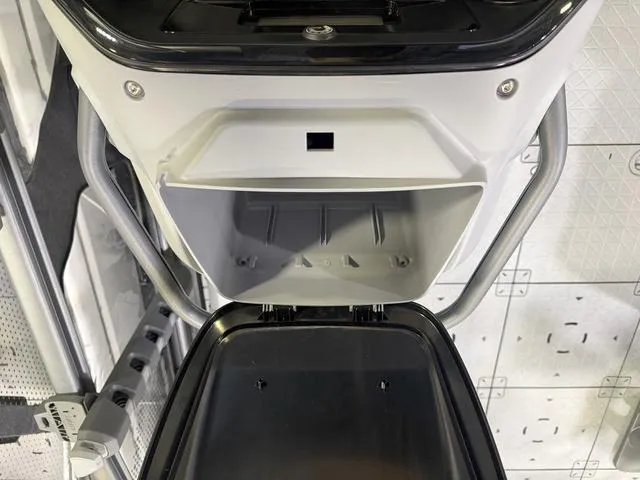 Slide: The Image of 2025 Sea-Doo Switch™ Fish 18 storage compartment, open lid, showcasing interior design. - 14