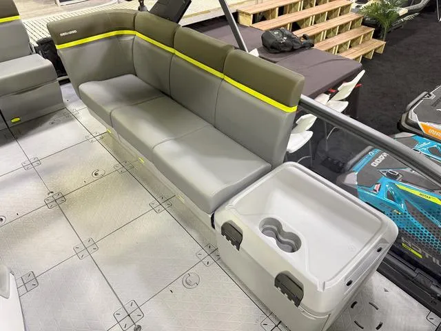 Slide: The Image of 2025 Sea-Doo Switch™ Fish 18 interior with gray seating and storage compartment. - 15