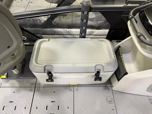 Slide: The Image of 2025 Sea-Doo Switch™ Fish 18 interior with storage box and seating area. - 18