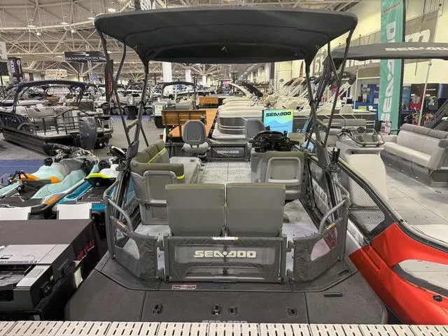 Slide: The Image of 2025 Sea-Doo Switch™ Fish 18 - 230 Hp Painted, showcased at a boat exhibition. - 27