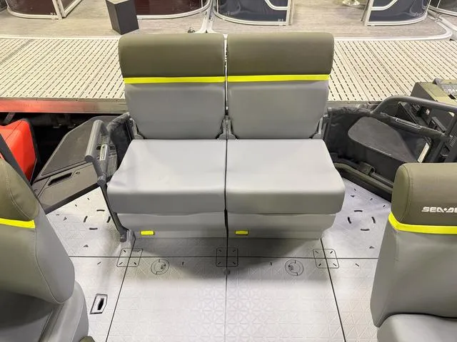 Slide: The Image of 2025 Sea-Doo Switch Fish 18 interior seating with gray upholstery and yellow accents. - 4