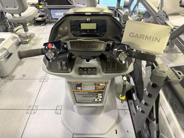Slide: The Image of 2025 Sea-Doo Switch™ Fish 18 dashboard with Garmin navigation system and controls. - 9