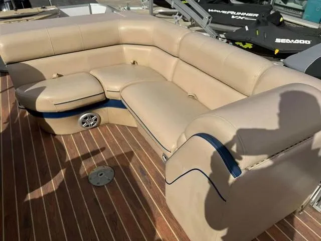 Slide: The Image of Luxurious beige seating on 2016 South Bay 523FCR 2.75 pontoon boat deck. - 12