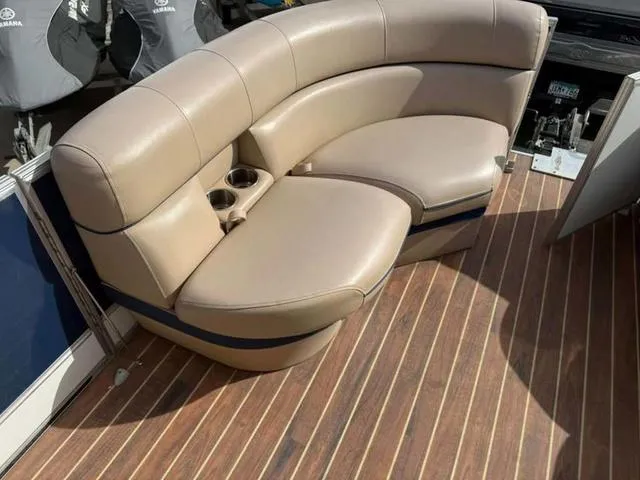 Slide: The Image of 2016 South Bay 523FCR 2.75 boat interior with beige seating and wooden flooring. - 8