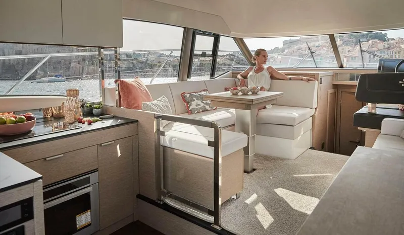 Slide: The Image of Luxurious interior of 2024 Prestige 420 Fly yacht with elegant dining area and scenic views. - 8