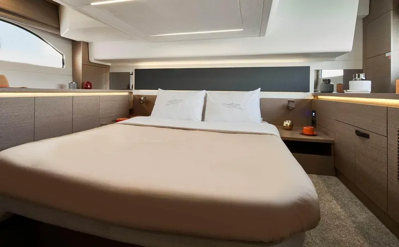 Slide: The Image of Luxurious bedroom interior of 2024 Prestige 420 Fly yacht with modern design and ambient lighting. - 13