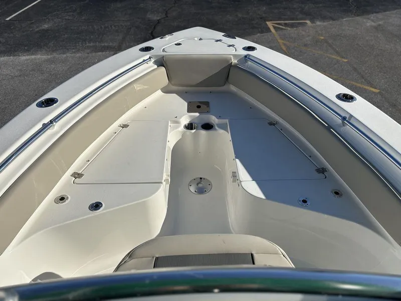 Slide: The Image of 2025 Key West 219 FS boat deck, featuring spacious seating and sleek design. - 15