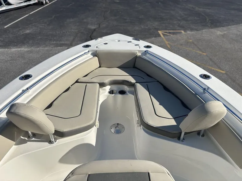 Slide: The Image of 2025 Key West 219 FS boat interior with cushioned seating and stainless steel railings. - 16