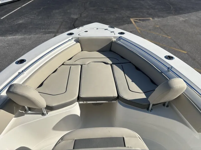 Slide: The Image of 2025 Key West 219 FS boat interior with cushioned seating and sleek design. - 17