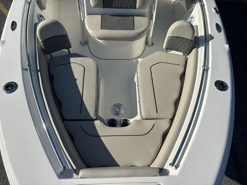 Slide: The Image of 2025 Key West 219 FS boat interior with cushioned seating and sleek design. - 18
