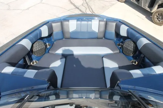 Slide: The Image of Interior of 2023 Malibu 21 LX boat with blue and gray seating. - 13