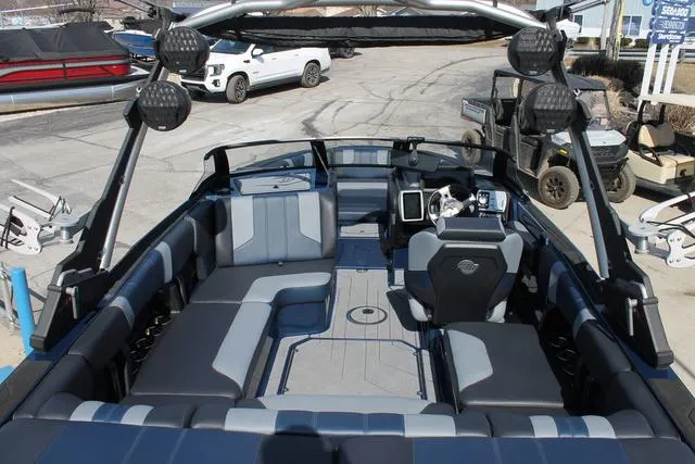 Slide: The Image of 2023 Malibu 21 LX boat interior with modern seating and dashboard design. - 6