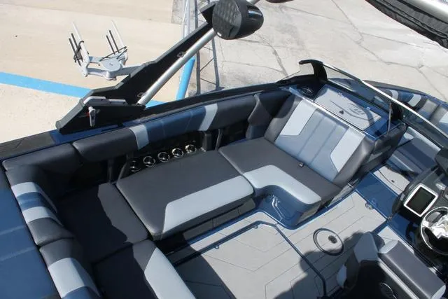 Slide: The Image of 2023 Malibu 21 LX boat interior with sleek seating and modern design features. - 7