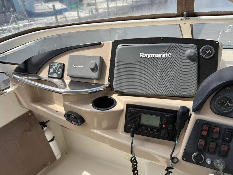 Slide: The Image of Control panel of a 2005 Carver 41 Cockpit Motor Yacht with Raymarine navigation equipment. - 16