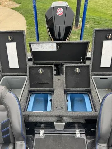 Slide: The Image of 2021 Tracker Nitro Z19 boat interior with storage compartments and seating. - 13