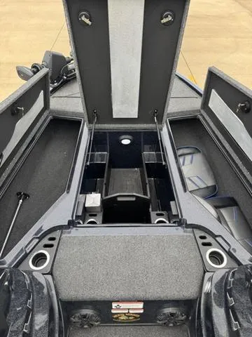 Slide: The Image of 2021 Tracker Nitro Z19 boat interior with open storage compartments and seating. - 8