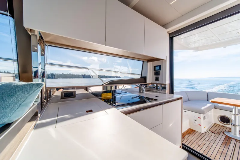 Slide: The Image of Modern kitchen interior on 2024 Prestige 460 Fly yacht with ocean view. - 4