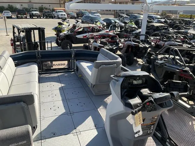 Slide: The Image of 2024 Sea-Doo Switch® Cruise 21 - 230 hp pontoon boat interior with seating and controls. - 10