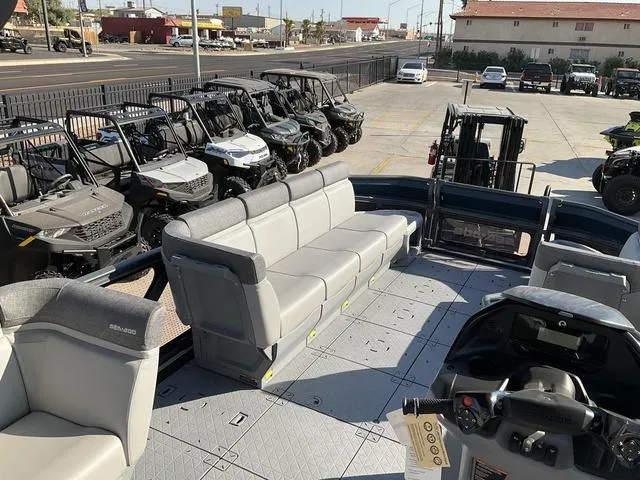 Slide: The Image of 2024 Sea-Doo Switch® Cruise 21 - 230 hp pontoon boat interior with seating and controls. - 11