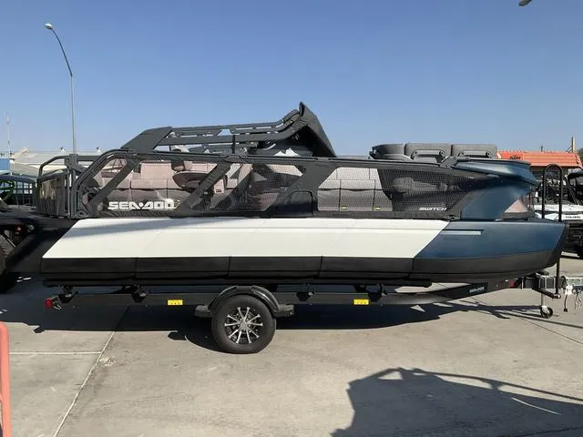 Slide: The Image of 2024 Sea-Doo Switch® Cruise 21 boat on trailer, parked outdoors. - 4