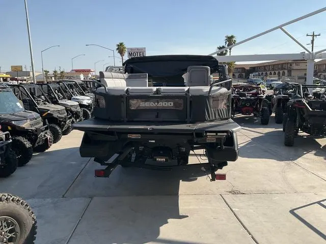 Slide: The Image of 2024 Sea-Doo Switch® Cruise 21 - 230 hp pontoon boat displayed at dealership. - 6