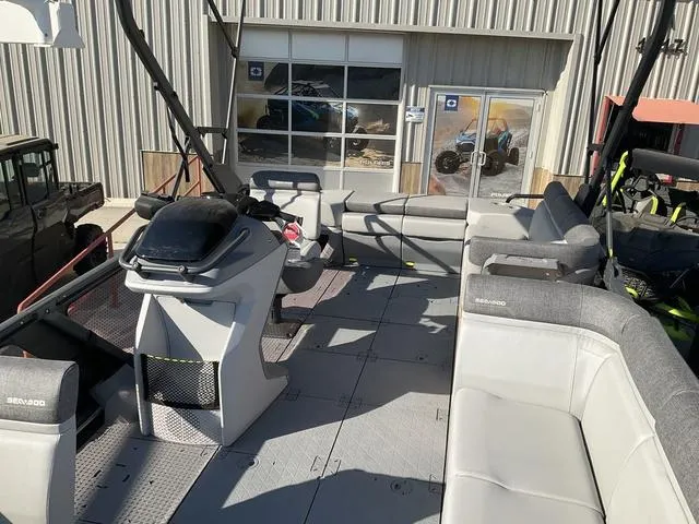 Slide: The Image of 2024 Sea-Doo Switch® Cruise 21 boat interior with seating and control console. - 8