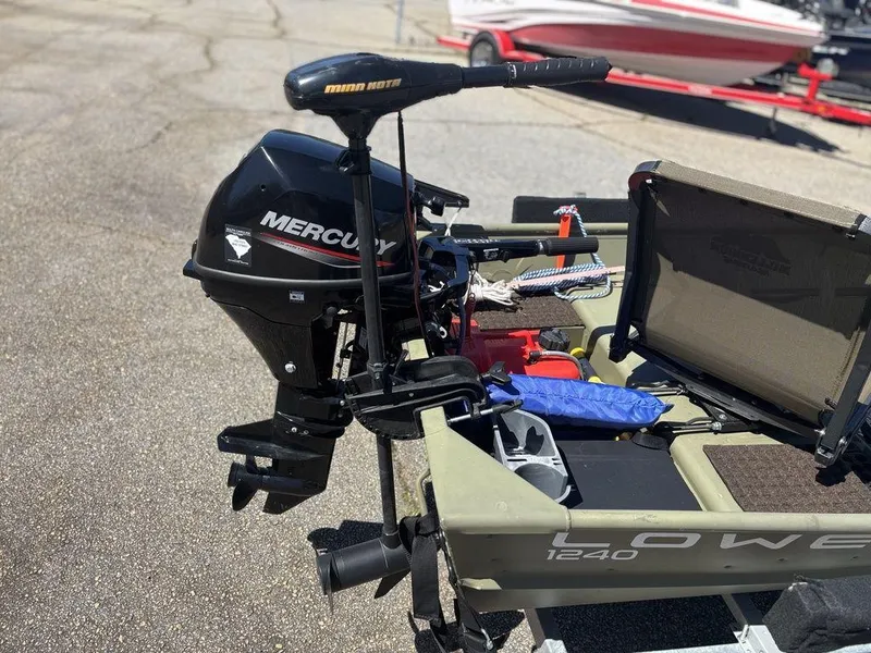 Slide: The Image of 2024 Lowe L1240 Jon boat with Mercury motor and Minn Kota trolling motor. - 6