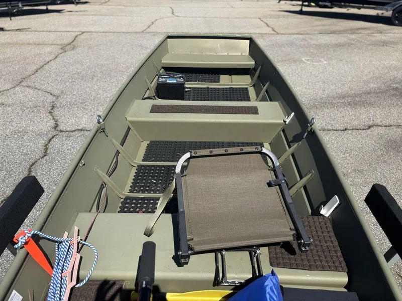 Slide: The Image of 2024 Lowe L1240 Jon boat interior with seating and storage compartments. - 9